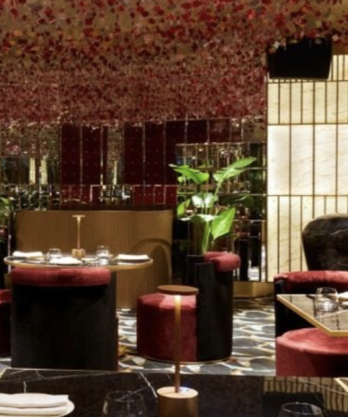 Modern fine dining interior with floral ceiling and ambient lighting